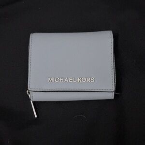 Michael Kors wallet that can fit credit cards, change, money, id, etc.
